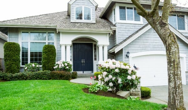Beautiful large white home with archway entrance